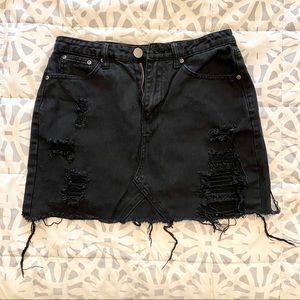 Black denim distressed skirt